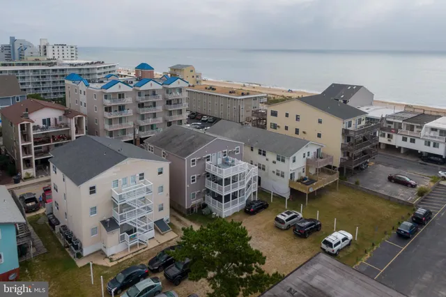 an aerial view of a house with outdoor space