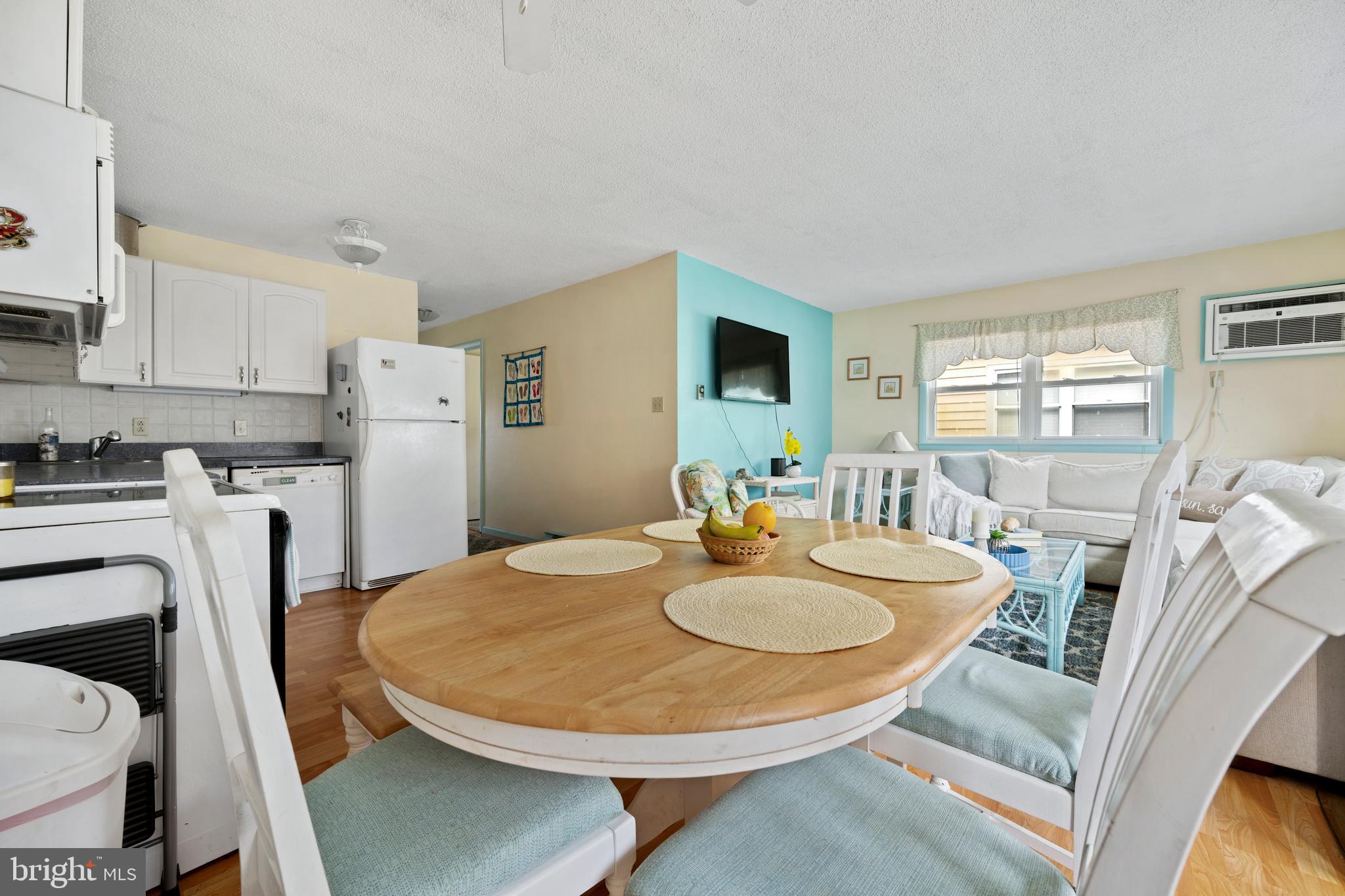 9 79th Street, Unit 3W Ocean City, MD 21842 - Photo 6 of 34 a dining room with furniture and wooden floor
