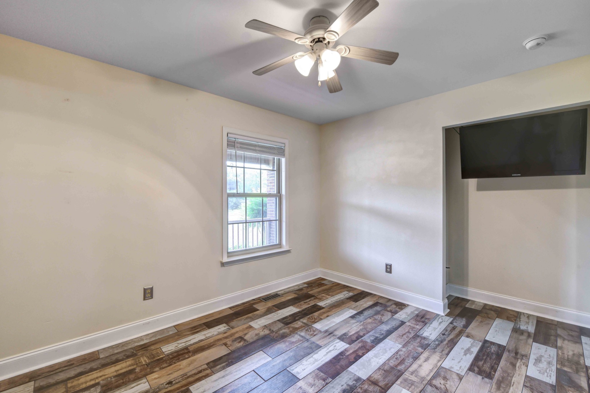 1926 Victorian Road Columbia, TN 38401 - Photo 14 of 28 wooden floor in an empty room with a window