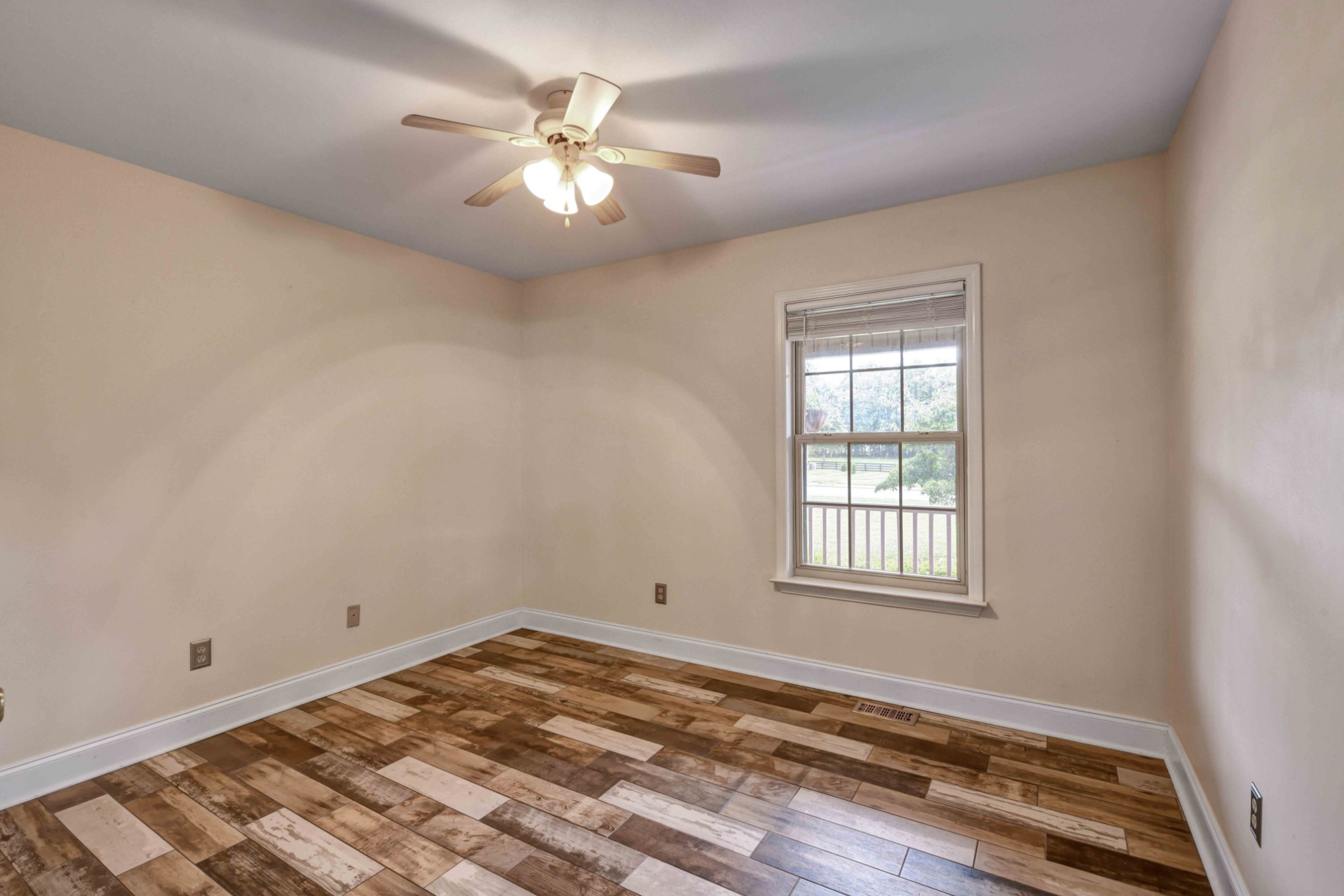 1926 Victorian Road Columbia, TN 38401 - Photo 17 of 28 wooden floor in an empty room with a window