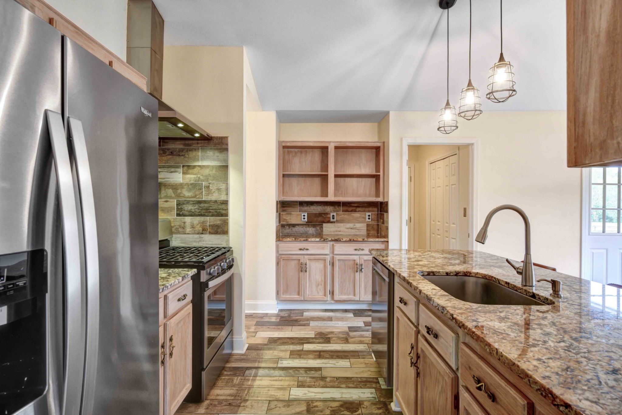 1926 Victorian Road Columbia, TN 38401 - Photo 7 of 28 a kitchen with stainless steel appliances granite countertop a sink a refrigerator and a stove