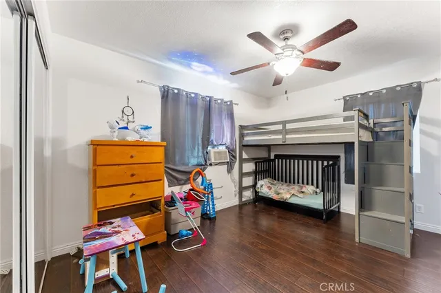 a bedroom with furniture and a window