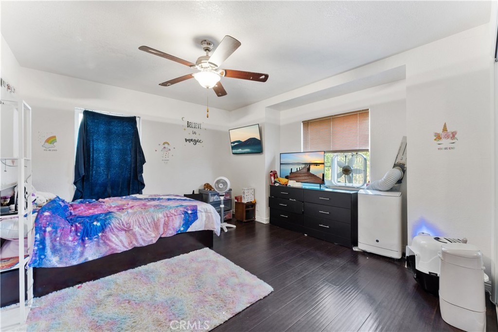 9127 Greenleaf Avenue Whittier, CA 90602 - Photo 35 of 39 a bedroom with a bed and a chandelier