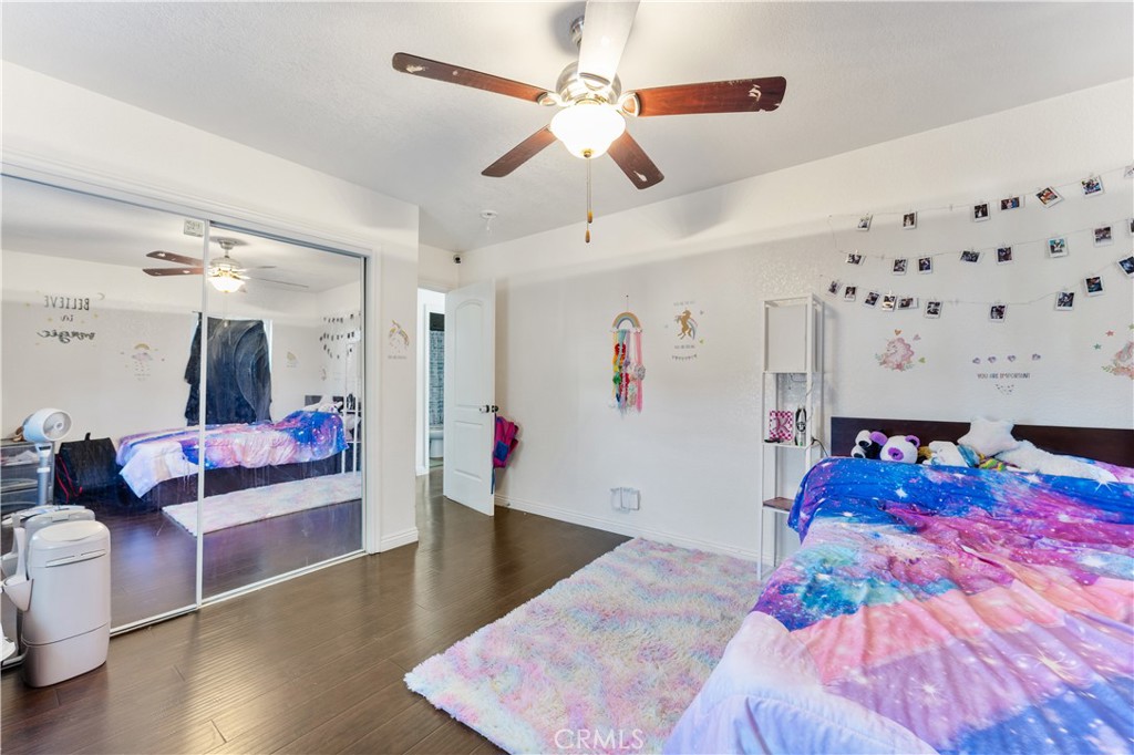 9127 Greenleaf Avenue Whittier, CA 90602 - Photo 36 of 39 a bed room with a bed couch and a ceiling fan