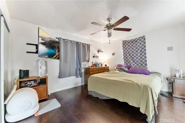 a bedroom with a bed and a mirror