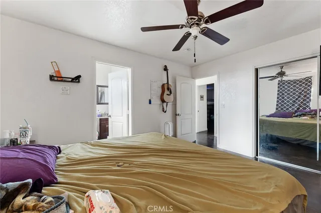 a bedroom with a bed and a walk in closet