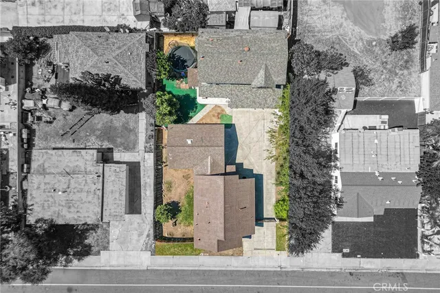 an aerial view of residential houses with outdoor space