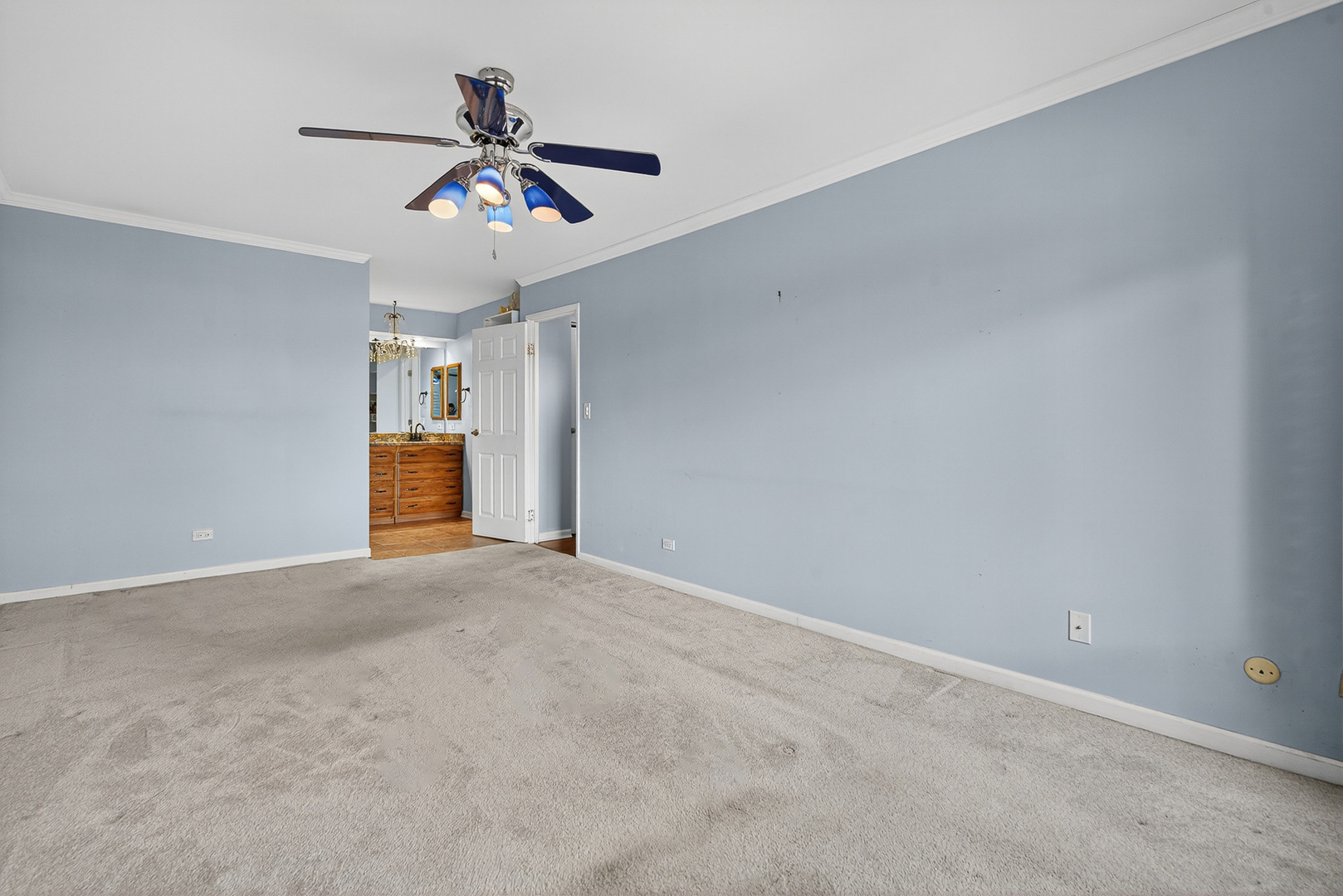 500 West Huntington Commons Road, Unit 253 Mount Prospect, IL 60056 - Photo 12 of 24 a view of an empty room with a ceiling fan and window