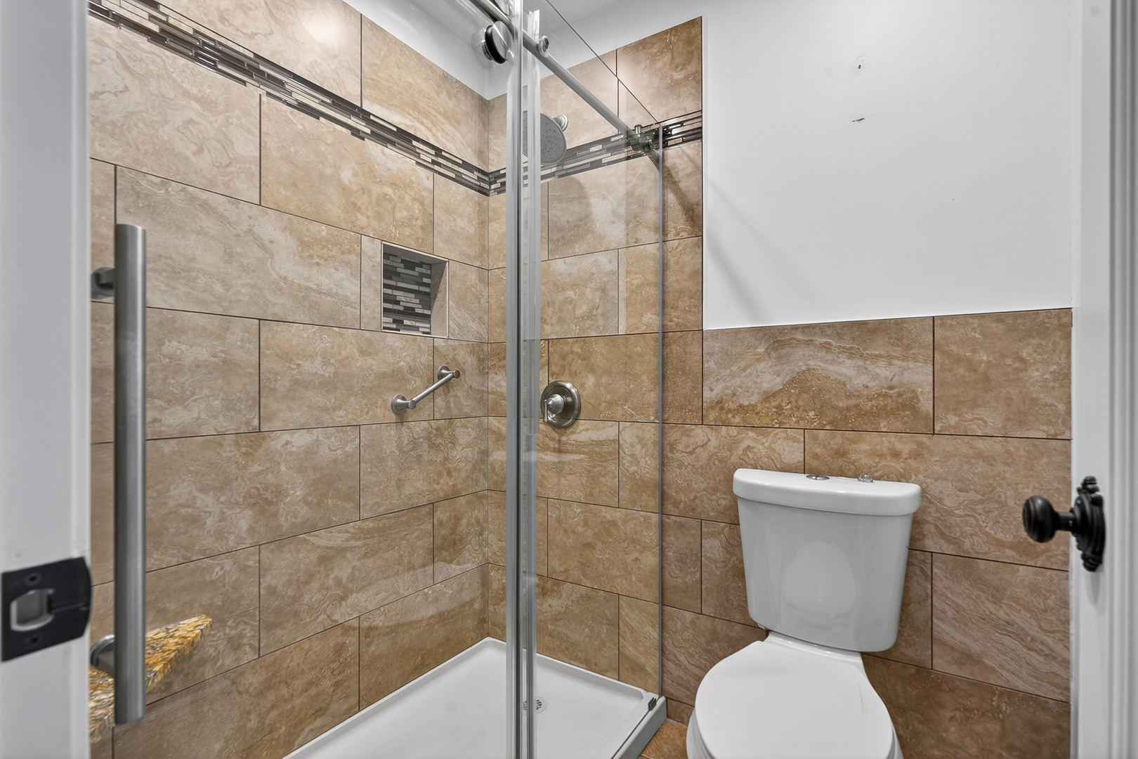 500 West Huntington Commons Road, Unit 253 Mount Prospect, IL 60056 - Photo 14 of 24 a bathroom with a toilet and a shower