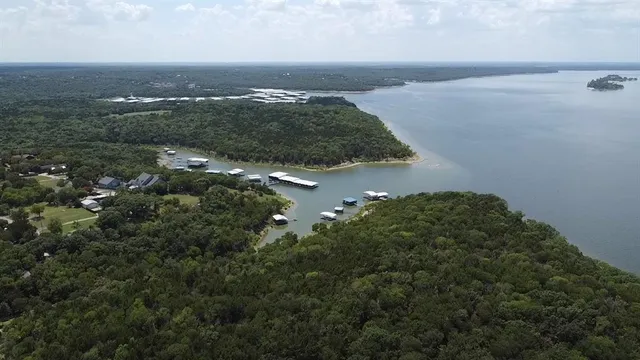 a view of a house with pool and deck