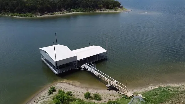 an aerial view of house with yard
