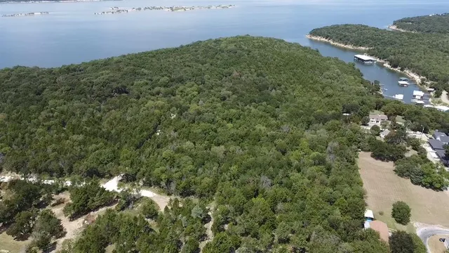 an aerial view of a houses with yard