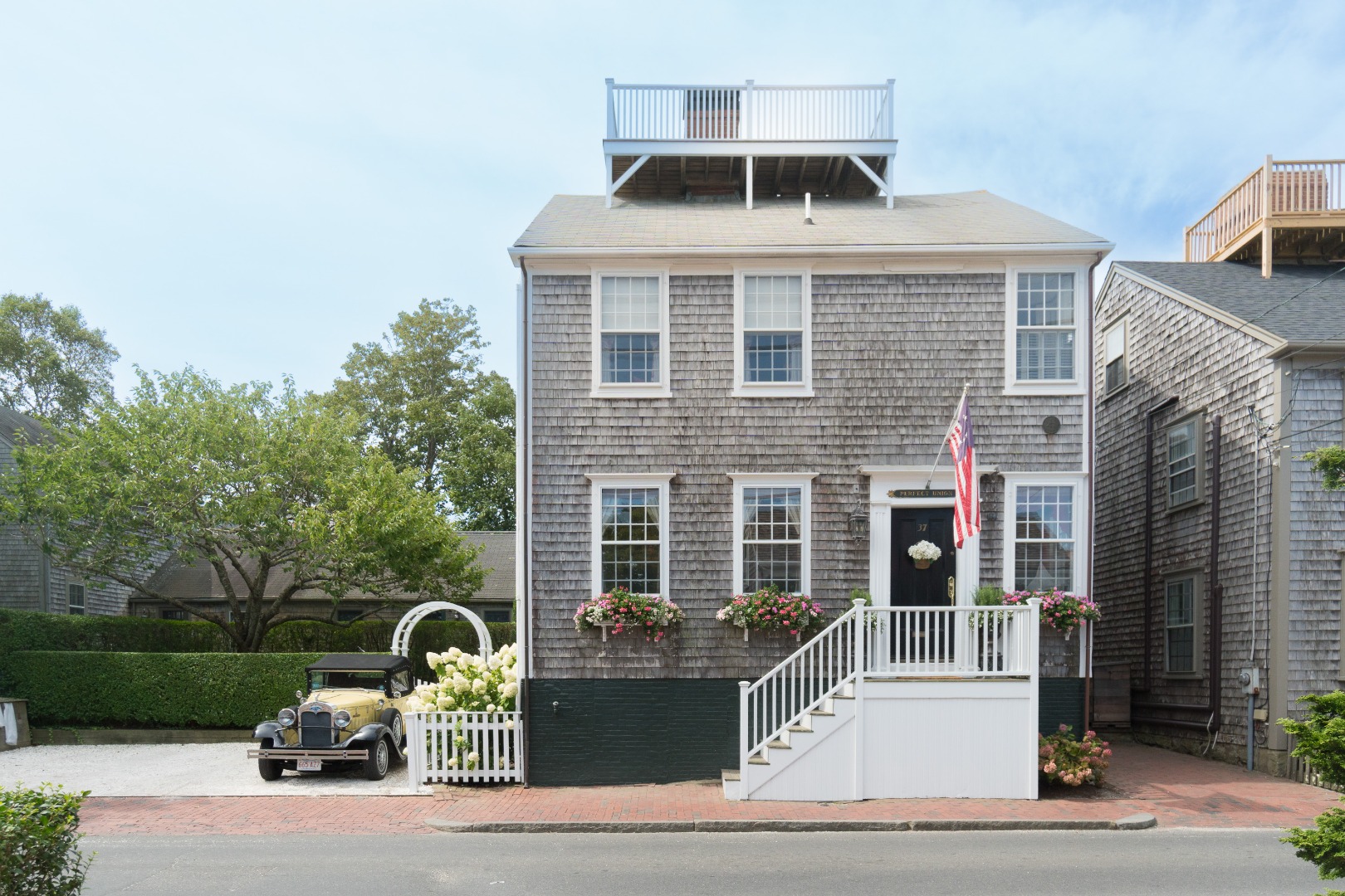 37 Union Street Nantucket, MA 02554 - Photo 21 of 25 a front view of a house with a yard
