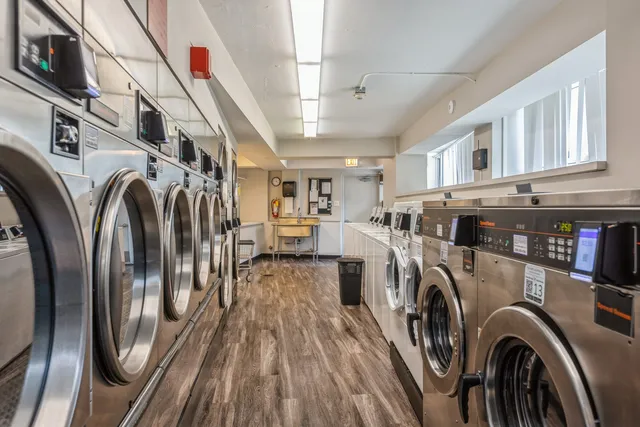 a view of a storage and utility room with washer and dryer