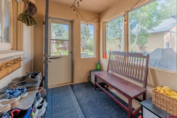 a bedroom with furniture and a window