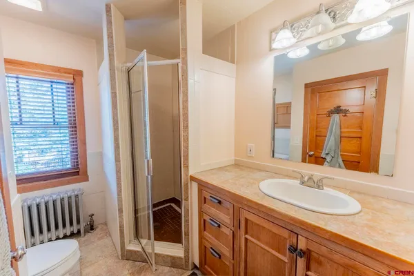 a bathroom with a sink double vanity and a mirror