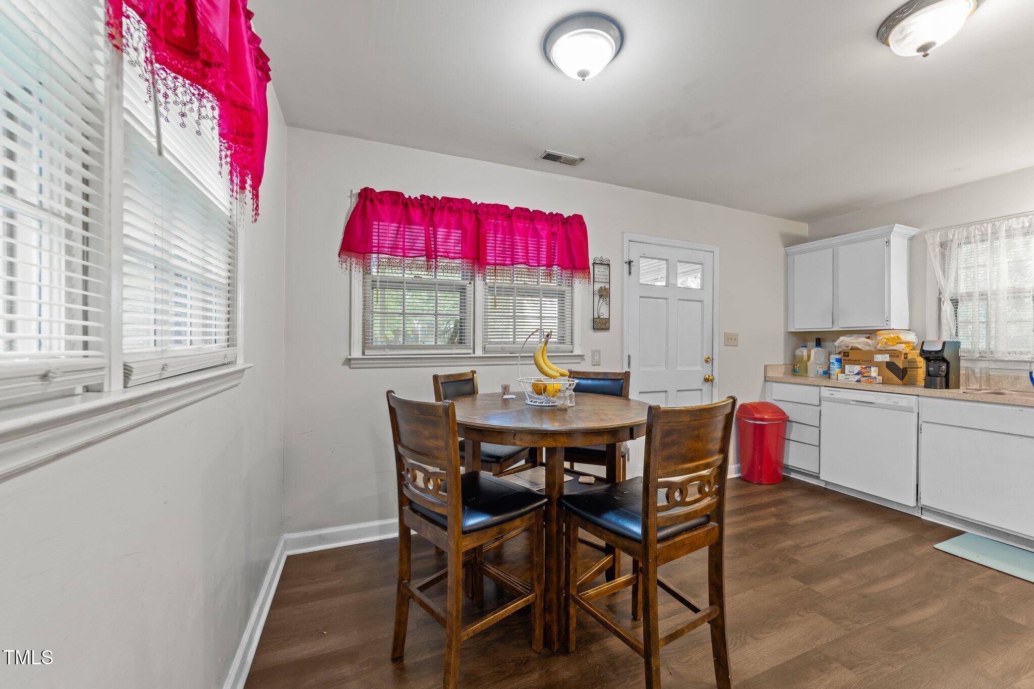 313 Colleton Road Raleigh, NC 27610 - Photo 11 of 32 a dining room with furniture and window