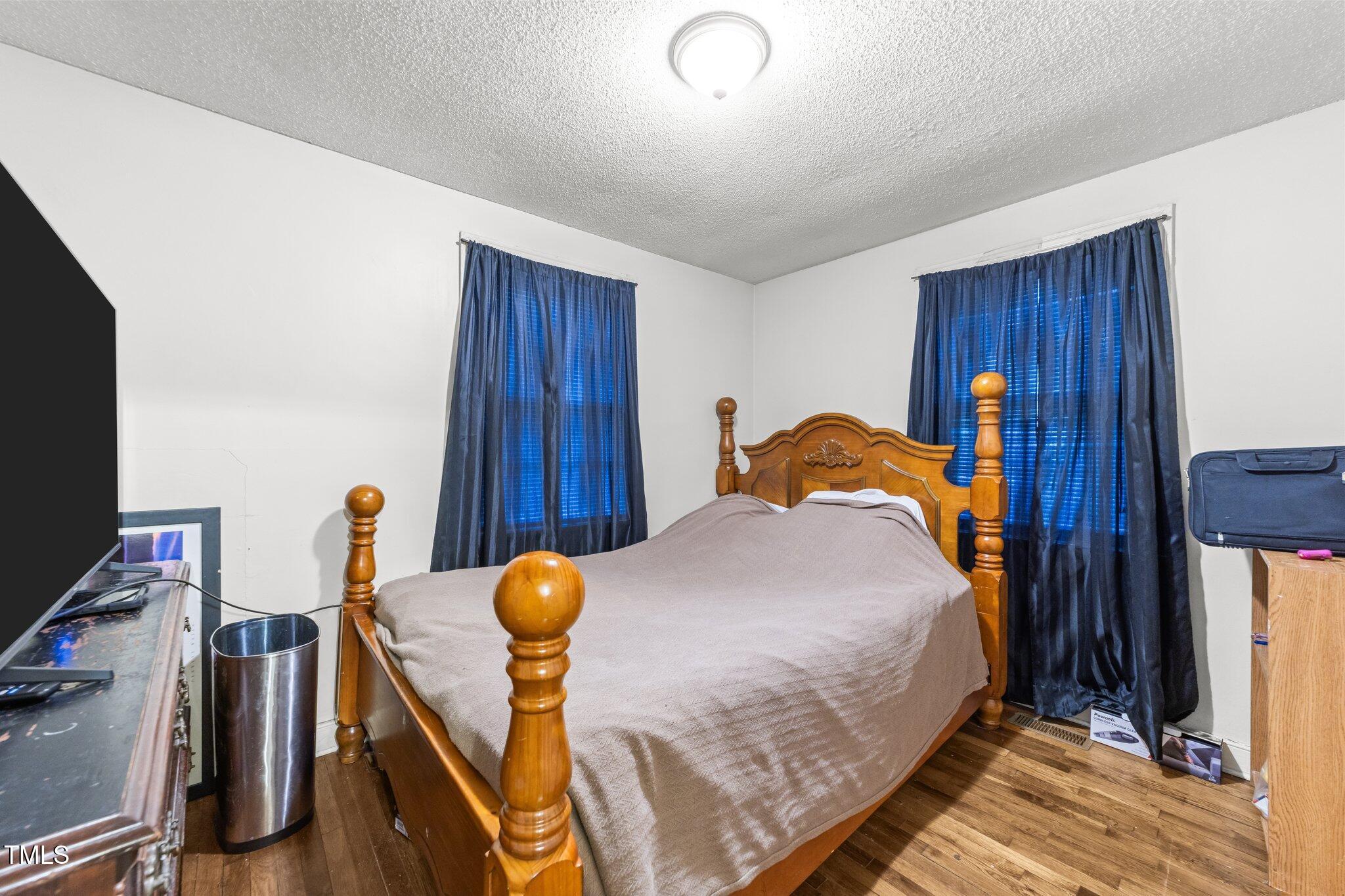 313 Colleton Road Raleigh, NC 27610 - Photo 14 of 32 a bedroom with furniture and natural light
