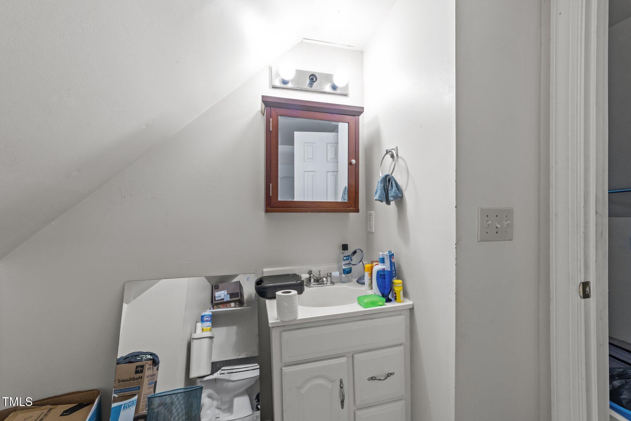 313 Colleton Road Raleigh, NC 27610 - Photo 17 of 32 a room with a window a washer and dryer