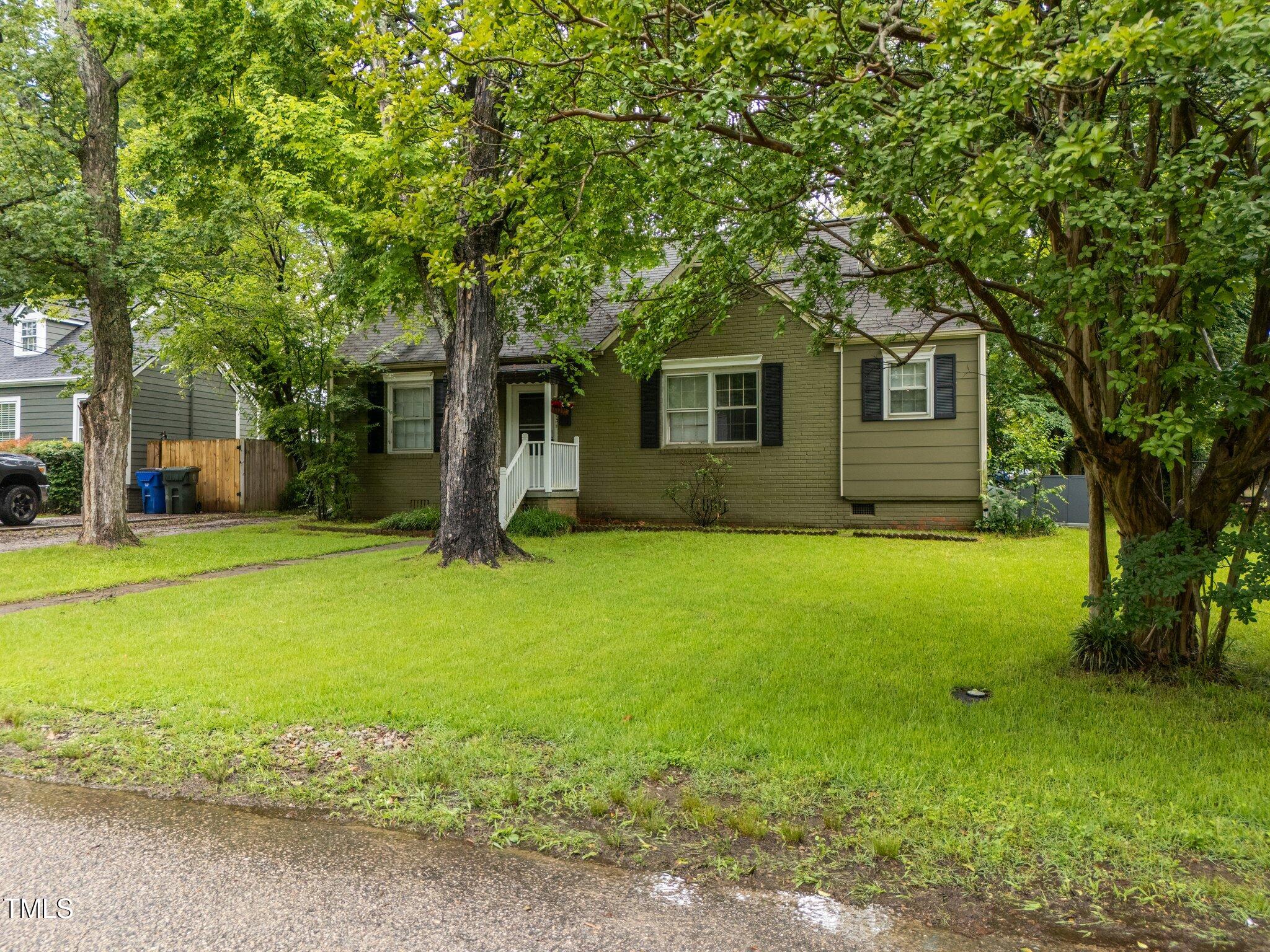 313 Colleton Road Raleigh, NC 27610 - Photo 2 of 32 a front view of house with yard and green space
