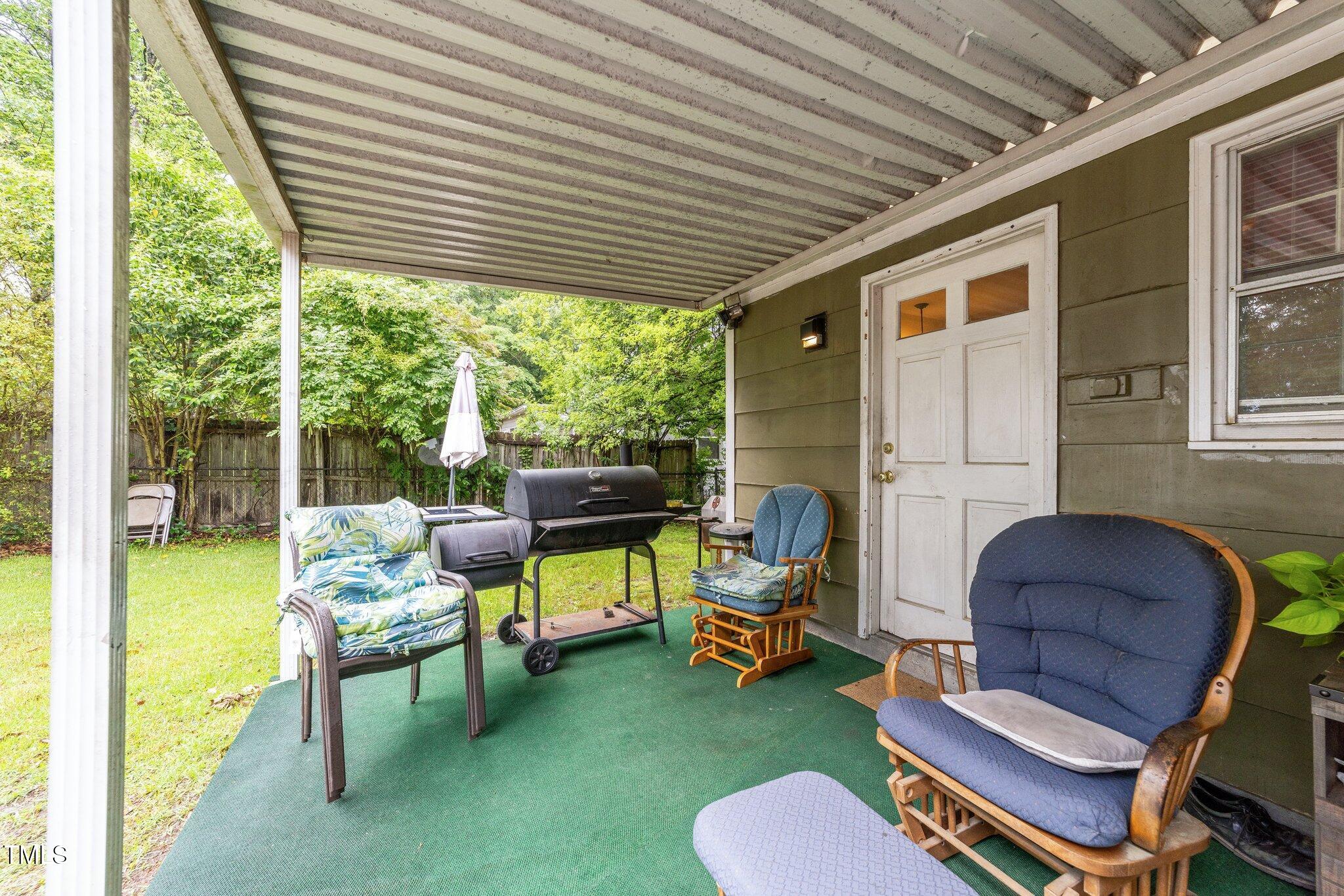 313 Colleton Road Raleigh, NC 27610 - Photo 21 of 32 a outdoor living space with furniture and garden view