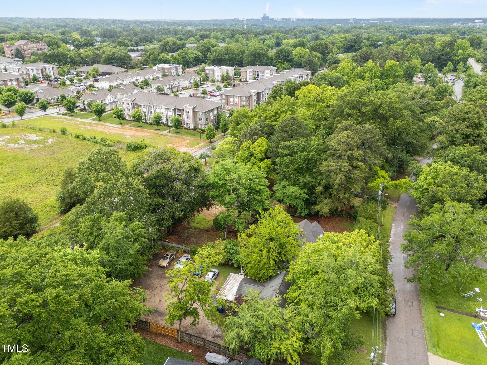 313 Colleton Road Raleigh, NC 27610 - Photo 30 of 32 an aerial view of residential houses with outdoor space and trees