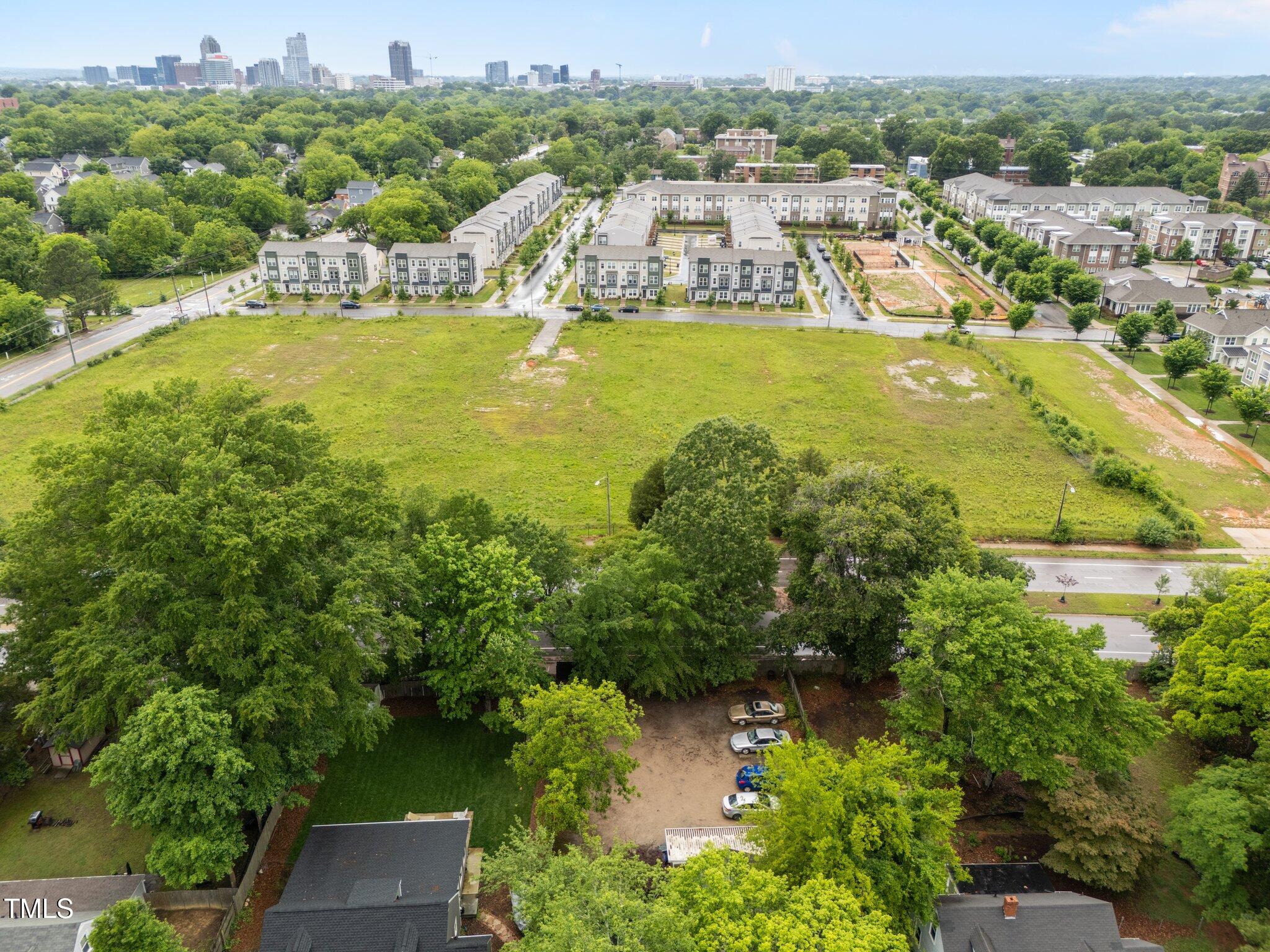 313 Colleton Road Raleigh, NC 27610 - Photo 31 of 32 an aerial view of residential houses with outdoor space and swimming pool