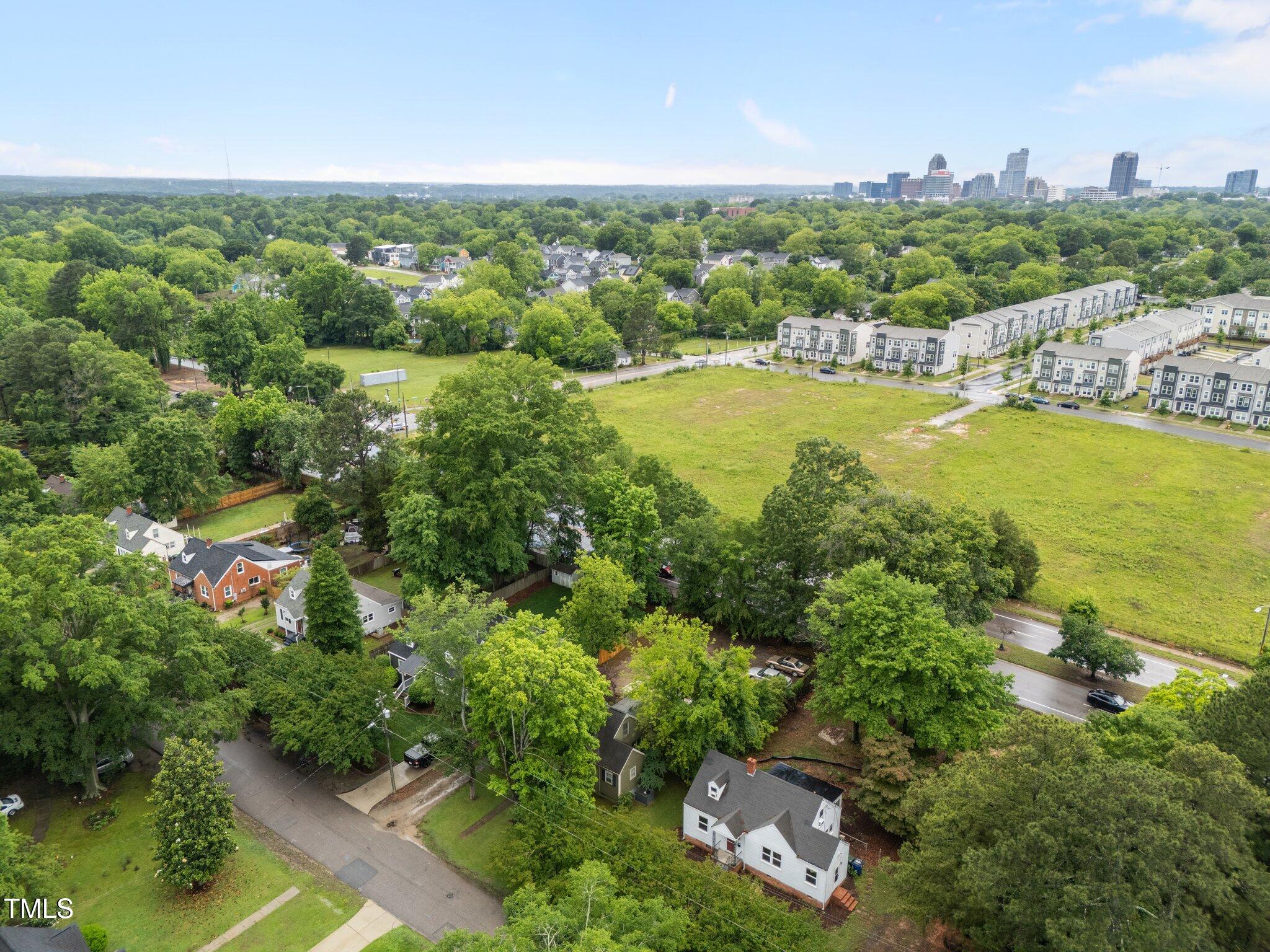 313 Colleton Road Raleigh, NC 27610 - Photo 32 of 32 an aerial view of a houses with a yard and lake view