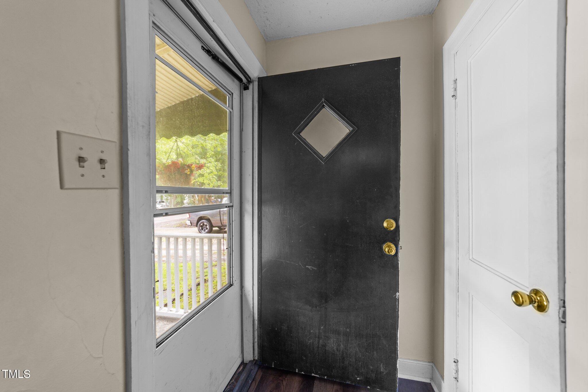 313 Colleton Road Raleigh, NC 27610 - Photo 4 of 32 a bathroom with a bathtub and a window