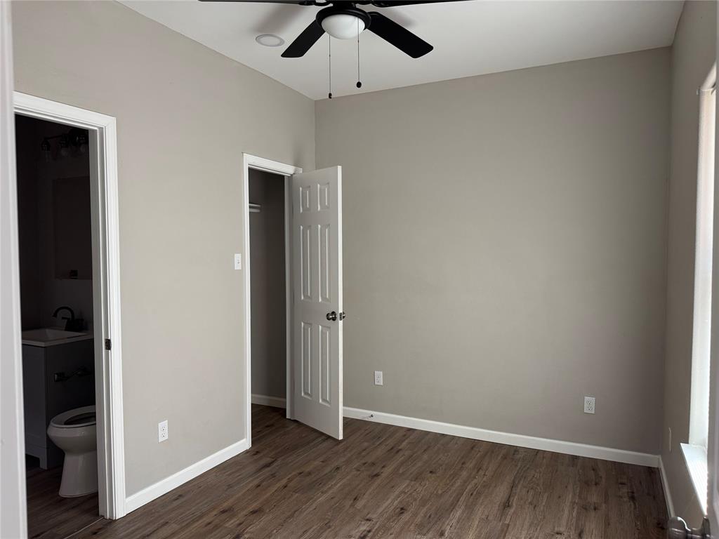 211 North Bermuda Street Lacy-Lakeview, TX 76705 - Photo 12 of 23 an empty room with wooden floor closet and windows