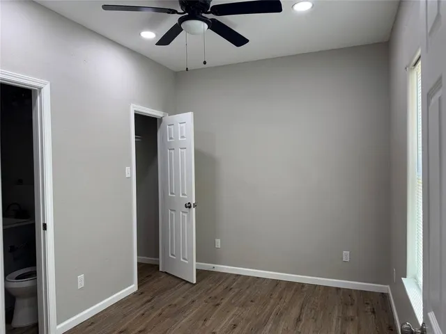 a white toilet sitting next to a bathroom sink