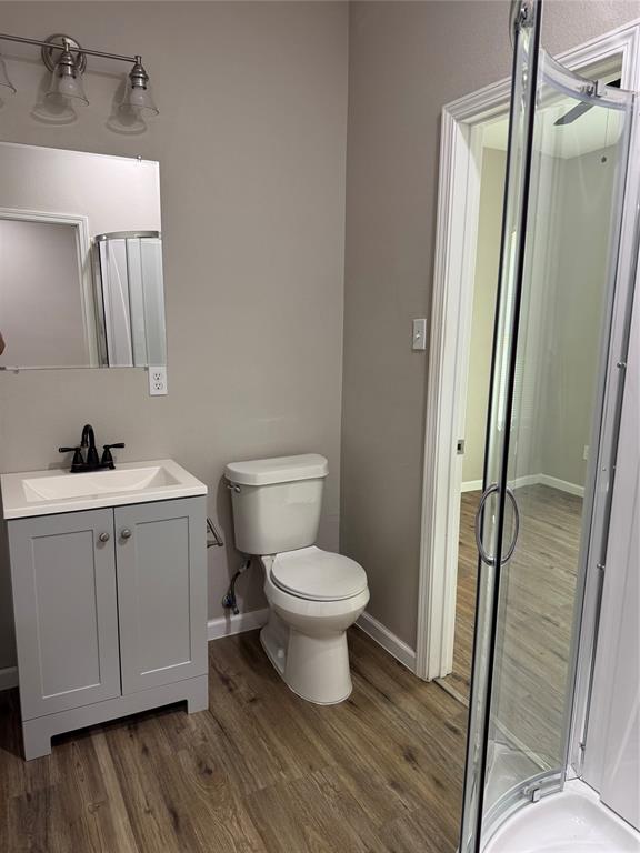 211 North Bermuda Street Lacy-Lakeview, TX 76705 - Photo 14 of 23 a white toilet sitting next to a bathroom sink