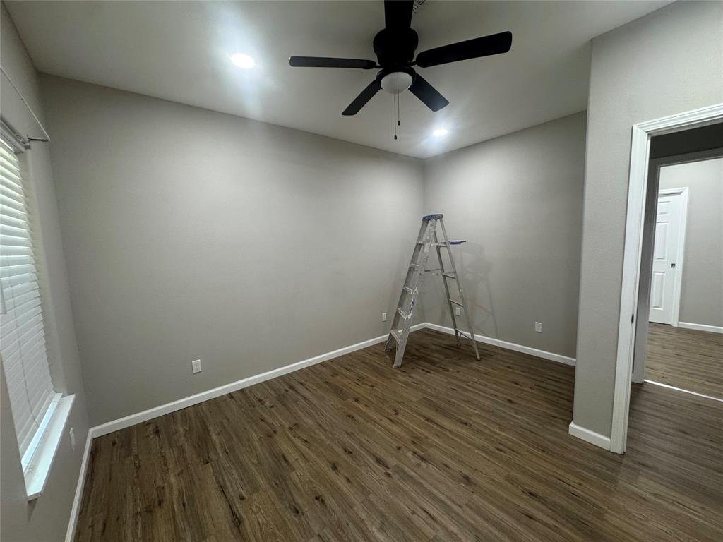 211 North Bermuda Street Lacy-Lakeview, TX 76705 - Photo 20 of 23 an empty room with wooden floor and windows