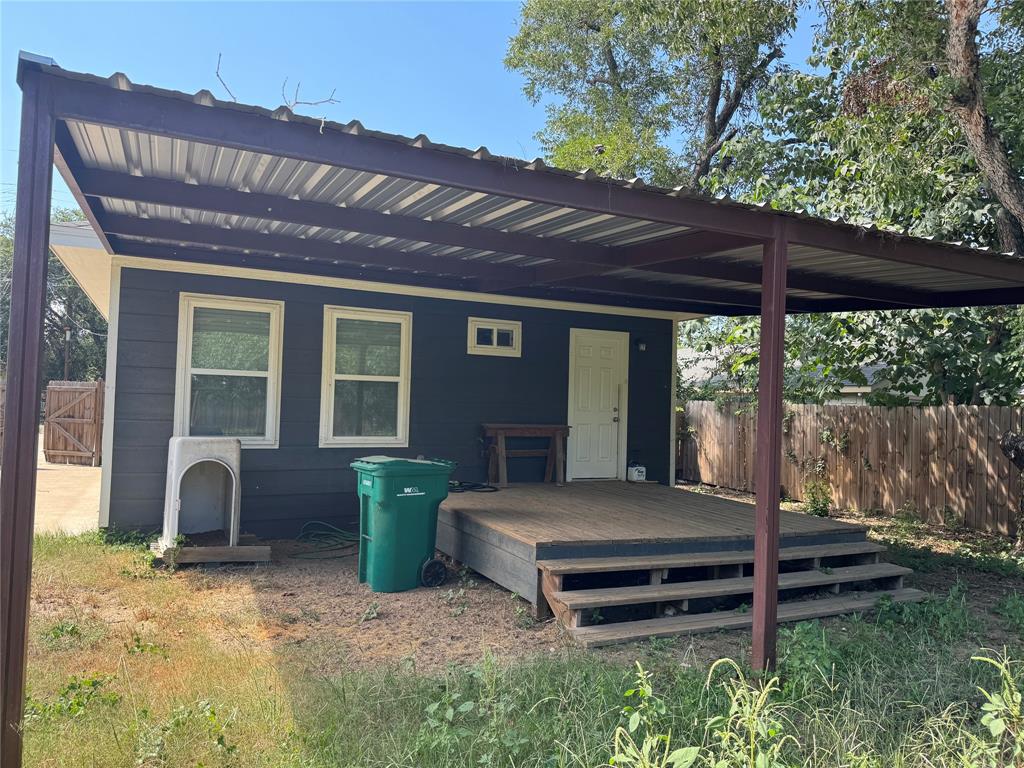 211 North Bermuda Street Lacy-Lakeview, TX 76705 - Photo 4 of 23 a front view of a house with a garden