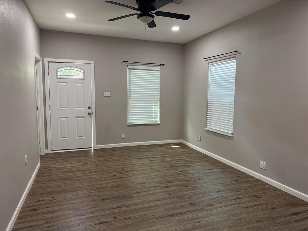 211 North Bermuda Street Lacy-Lakeview, TX 76705 - Photo 6 of 23 an empty room with window and wooden floor
