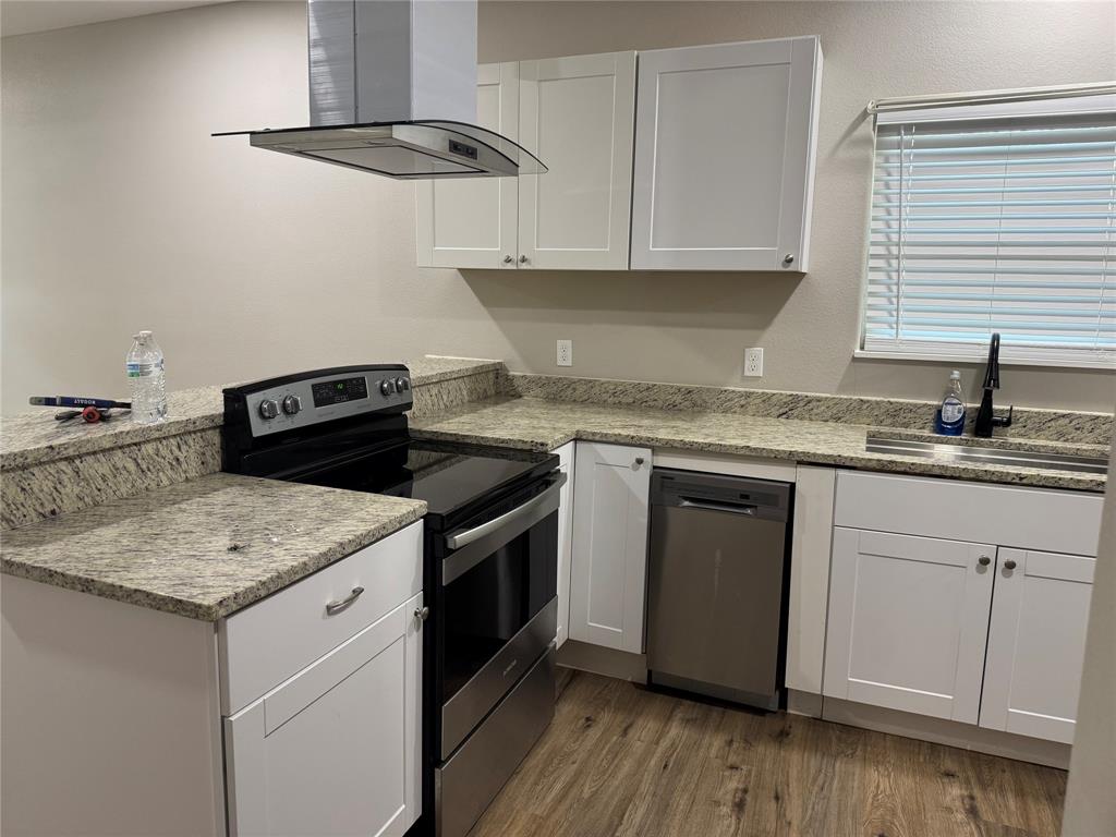 211 North Bermuda Street Lacy-Lakeview, TX 76705 - Photo 7 of 23 a kitchen with a sink stove and cabinets