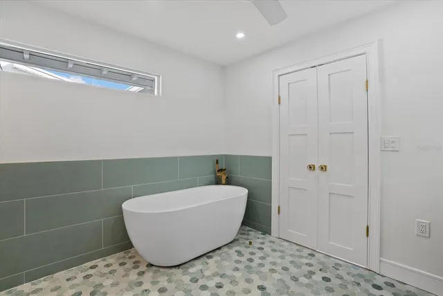 a bathroom with a bathtub and shower