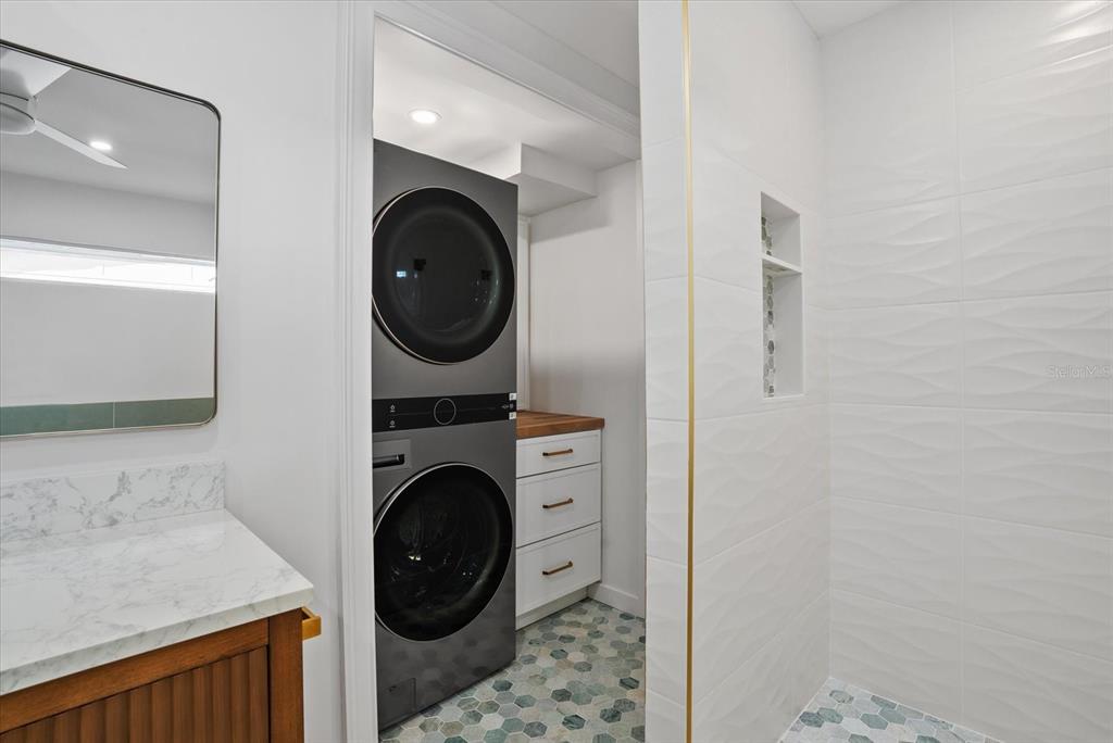 2104 Datura Street Sarasota, FL 34239 - Photo 22 of 48 a view of a hallway with washer and dryer