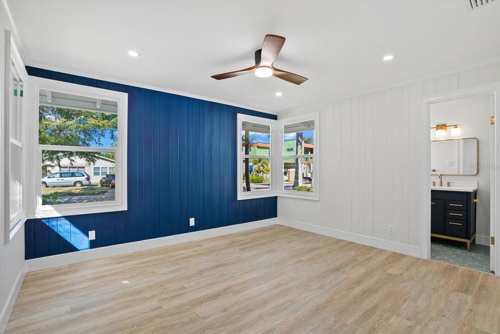 2104 Datura Street Sarasota, FL 34239 - Photo 23 of 48 a view of an empty room with a window and a kitchen