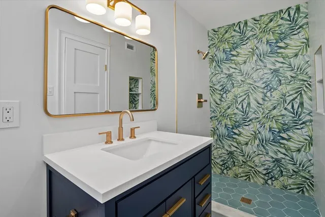 a bathroom with a sink and a mirror