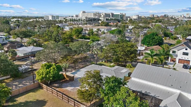an aerial view of residential building with green space