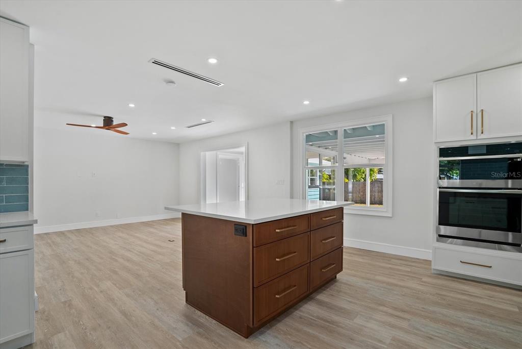2104 Datura Street Sarasota, FL 34239 - Photo 8 of 48 a kitchen with stainless steel appliances granite countertop a stove and a sink