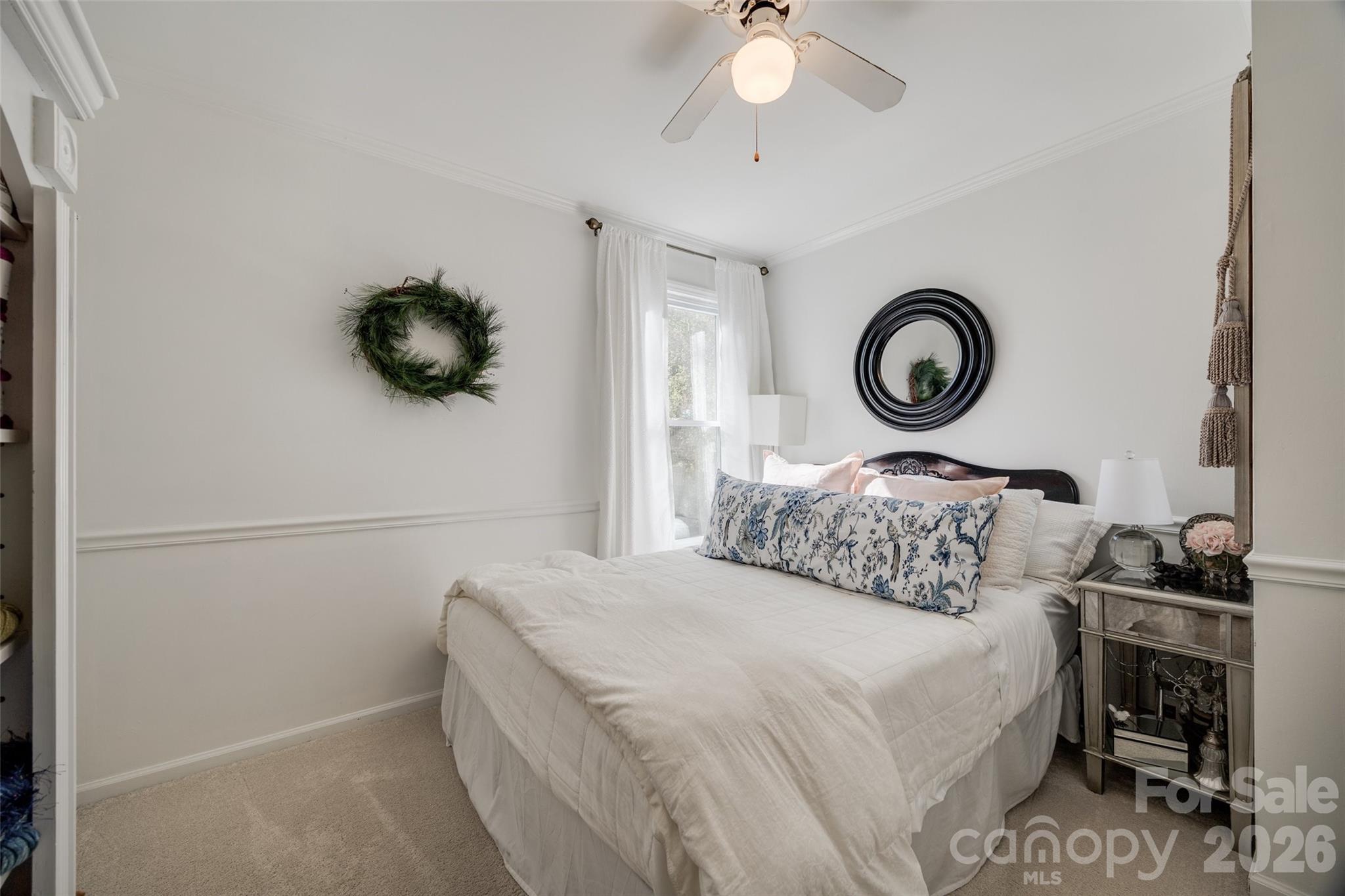 2915 Timber Ridge Lane Rock Hill, SC 29732 - Photo 11 of 41 a bedroom with a bed and a chandelier