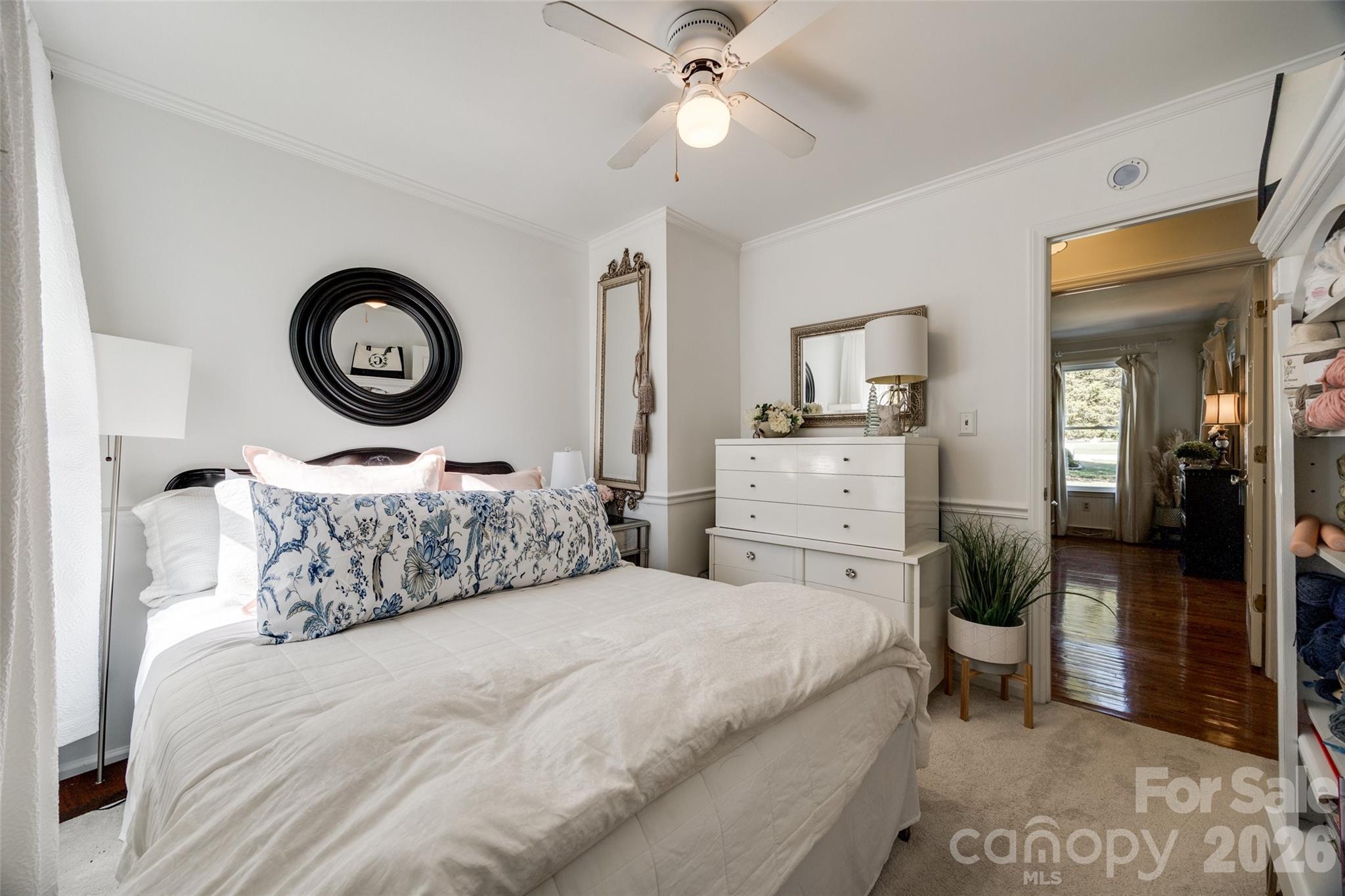 2915 Timber Ridge Lane Rock Hill, SC 29732 - Photo 12 of 41 a bedroom with a bed and a chandelier