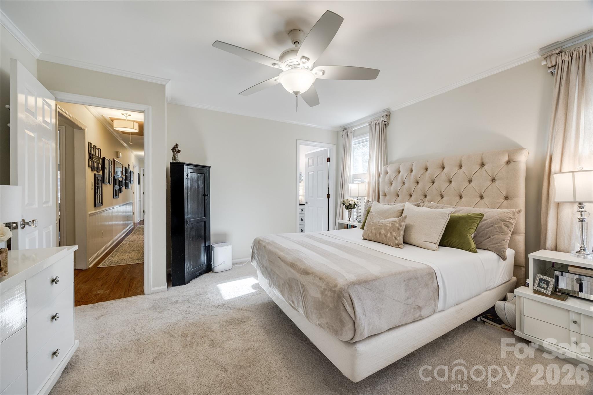 2915 Timber Ridge Lane Rock Hill, SC 29732 - Photo 15 of 41 a bedroom with a large bed and a chandelier