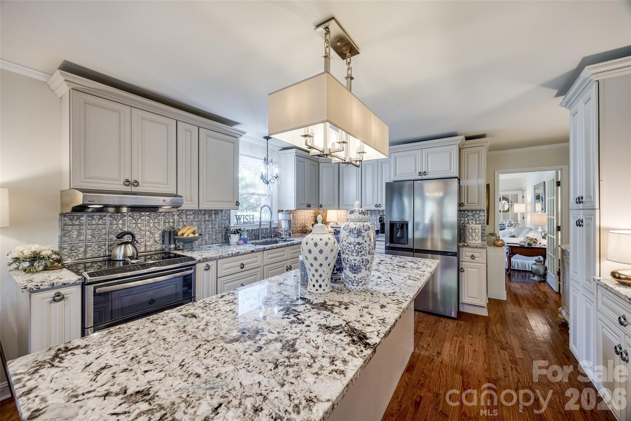 2915 Timber Ridge Lane Rock Hill, SC 29732 - Photo 17 of 41 a kitchen with stainless steel appliances kitchen island granite countertop a sink stove and refrigerator