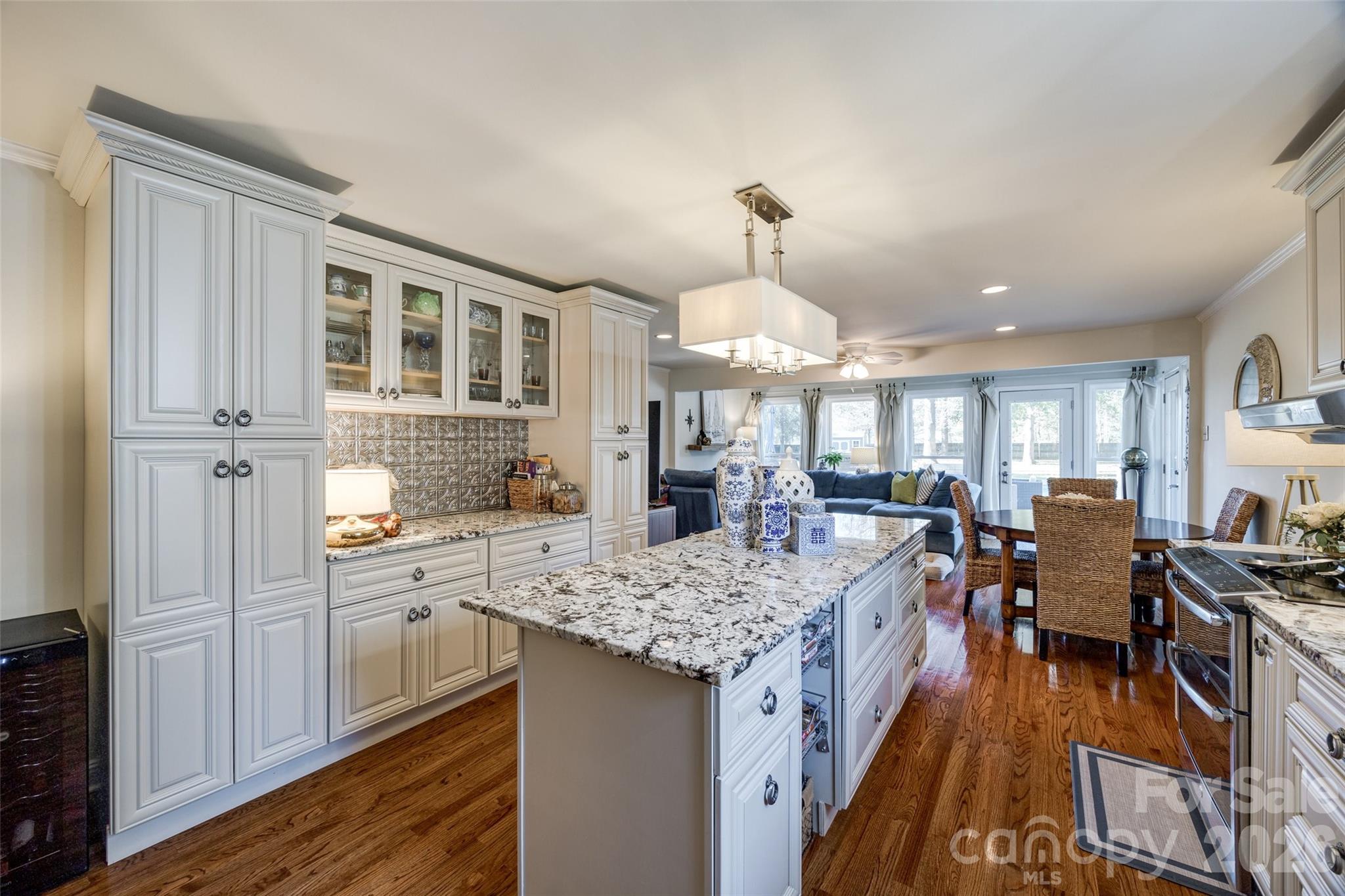 2915 Timber Ridge Lane Rock Hill, SC 29732 - Photo 19 of 41 a kitchen with center island wooden floor and stainless steel appliances