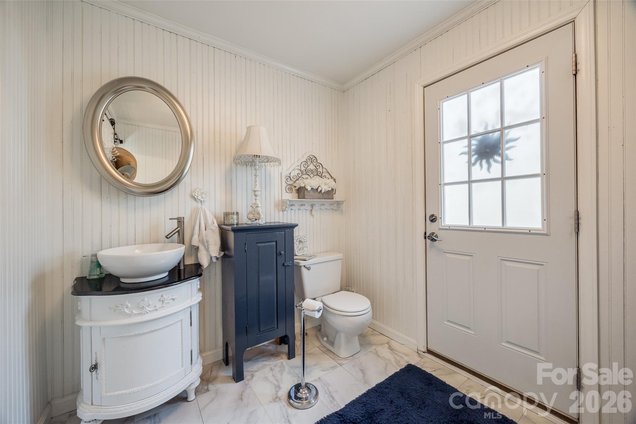2915 Timber Ridge Lane Rock Hill, SC 29732 - Photo 26 of 41 a bathroom with a toilet a sink and a mirror