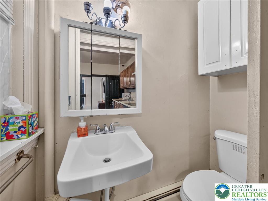 425 Ridge Street Emmaus, PA 18049 - Photo 17 of 27 A compact and functional bathroom on the first floor offering essential amenities in a practical layout.