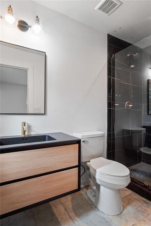 2327 El Paso Road Southwest Atlanta, GA 30331 - Photo 14 of 35 a bathroom with a toilet a sink and mirror